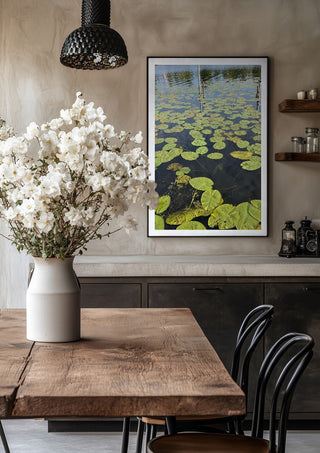 Sommarens sista andetag by Ljilja Marinic in a black frame above a rustic table with white flowers