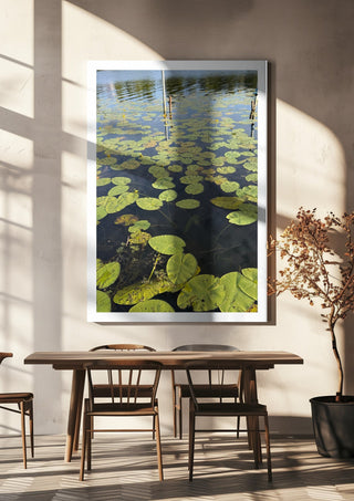 Sommarens sista andetag by Ljilja Marinic hanging above a wooden dining table in warm sunlight