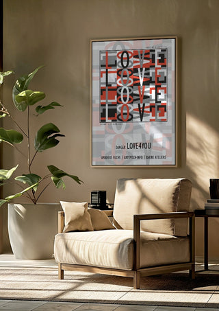 Danger Love4you - Type Signal by Amadeus Fuchs framed above a beige armchair beside a potted plant