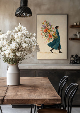 A Garden in Her Pocket by Matthews Gallerie in a black frame above a rustic table with white flowers