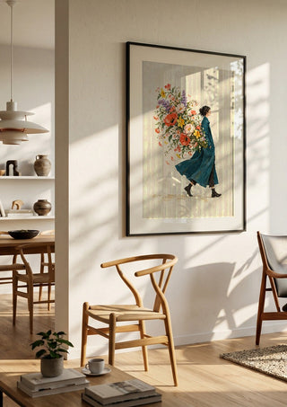A Garden in Her Pocket by Matthews Gallerie in a black frame in a bright dining room with wooden chairs
