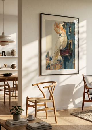 A Balcony of One’s Own by Matthews Gallerie in a black frame in a bright dining room with wooden chairs
