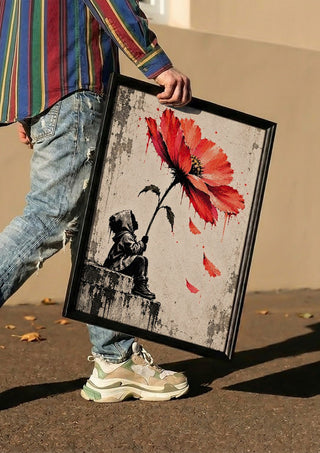 Under a Scarlet Bloom by Matthews Gallerie carried in a black frame along a sunny street