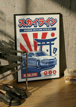 Nissan Skyline GTR R34 by Kaminarirace in a black frame leaning against a concrete wall by a steel chair