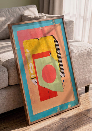 Vermilion Circle by Kareem Rizk in a walnut frame leaning against a grey sofa