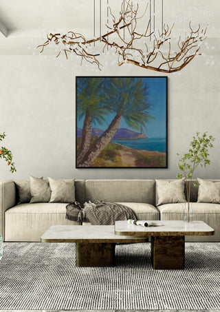 View from Isla Plana to La Azohía, Cartagena, Spain by PaKart in a black frame above a beige sofa under a branch chandelier