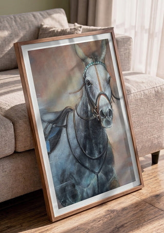 The Grey Horse by Mariia Nikolina in a walnut frame leaning against a grey sofa