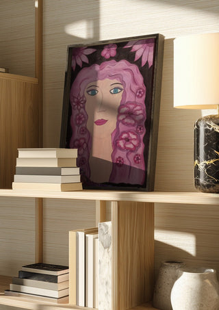 Flower Power by Carmen Coduri in a dark frame on a wooden shelf beside books and a lamp