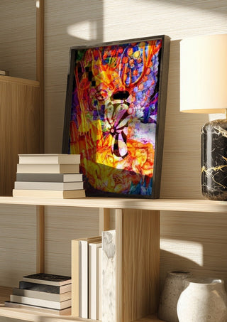 Diana by Carlos Enrique Gozalo Ara in a dark frame on a wooden shelf beside books and a lamp