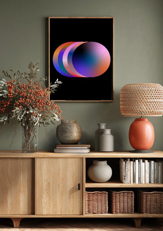 Layers by Aleksi Allan above a wooden sideboard on a sage green wall