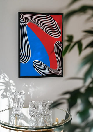 Stripes by Aleksi Allan in a black frame above a glass table with crystal glassware