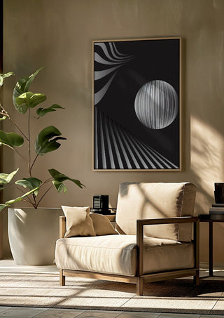 Monochrome II by Aleksi Allan framed above a beige armchair beside a potted plant