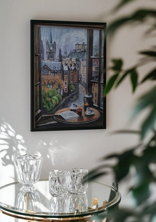 Rainy day by Dina in a black frame above a glass table with crystal glassware