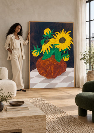 Gula blomster på rutig duk by Rebecka Hansson in a tall wooden frame leaning against a wall in a sunlit room