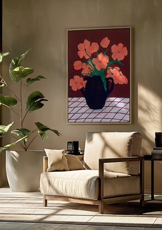 Rosa blomster på rutig duk by Rebecka Hansson framed above a beige armchair beside a potted plant