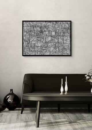 Mobility in Sight by Priit Ruttas in a black frame above a dark sofa with candlesticks