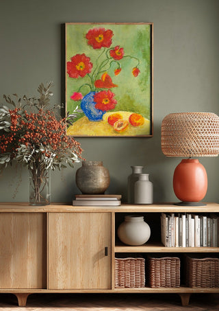 Poppies by Deblina Dey above a wooden sideboard on a sage green wall