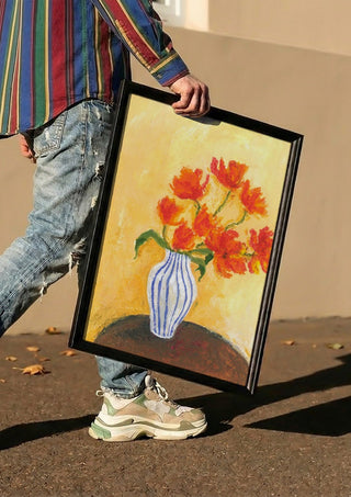 Tulips by Deblina Dey carried in a black frame along a sunny street