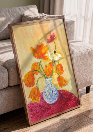 November Tulips by Deblina Dey in a walnut frame leaning against a grey sofa