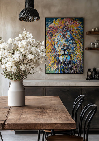 Soul of a Lion by Bibi in a black frame above a rustic table with white flowers