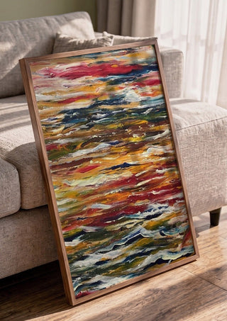 Feelings by Tonia in a walnut frame leaning against a grey sofa