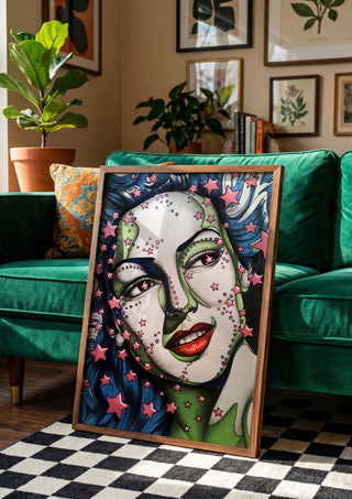 StarLady by Okiana in a wooden frame beside a green velvet sofa on a chequered floor