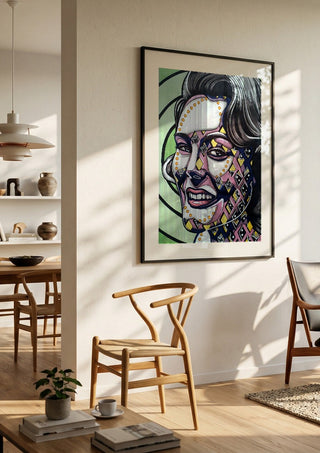 Vertigo by Okiana in a black frame in a bright dining room with wooden chairs