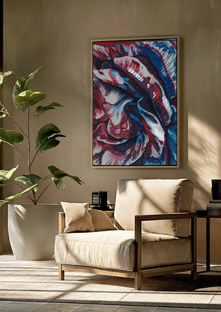 Rose by Okiana framed above a beige armchair beside a potted plant