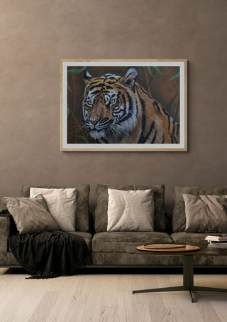 Solo Tiger by Sarah Daniels Art in an oak frame above a grey sofa with cushions