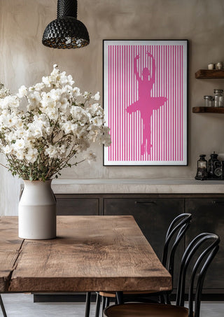Ballerina silhouette by nyai in a black frame above a rustic table with white flowers