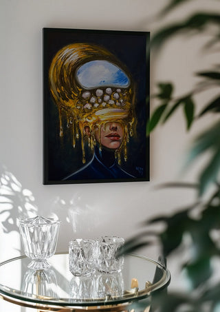 Between Worlds by Ronny Simon in a black frame above a glass table with crystal glassware