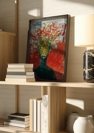 The Sound by Ronny Simon in a dark frame on a wooden shelf beside books and a lamp