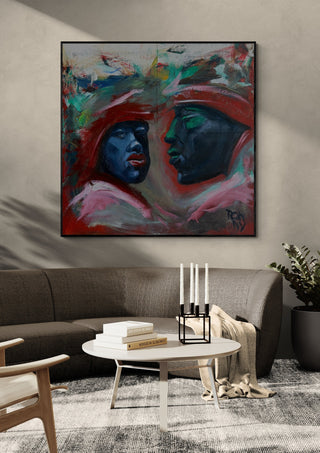 Meeting in Red by Ronny Simon in a black frame above a grey sofa with candlesticks