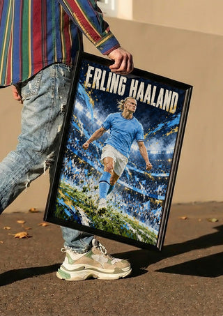 Erling Haaland by Danii Steinfeldt carried in a black frame along a sunny street