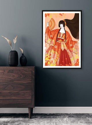 Framed art print of The Japanese Geisha by Kate Aitana displayed on a dark wall above a wooden dresser.