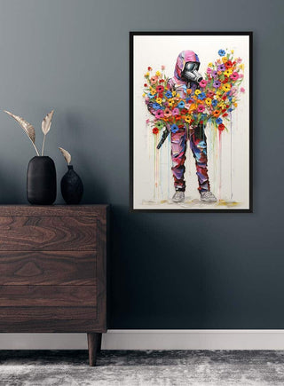Framed "Soldier of Peace" poster inspired by Banksy, showing a figure in a hoodie holding colorful flowers.