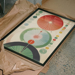 Green Hilma No. 2 poster in a black frame lying in protective packaging before shipping.