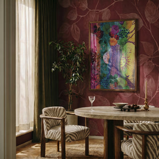 Celestial Cycle by Enikő Marosváry-Kramcsák framed on a deep red patterned wall