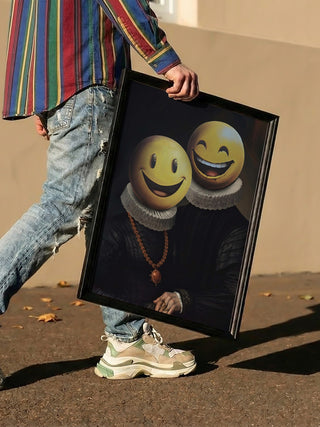 A person holds The Smilers - Dikhotomy artwork, showing two figures with smiley emoji faces in renaissance attire.