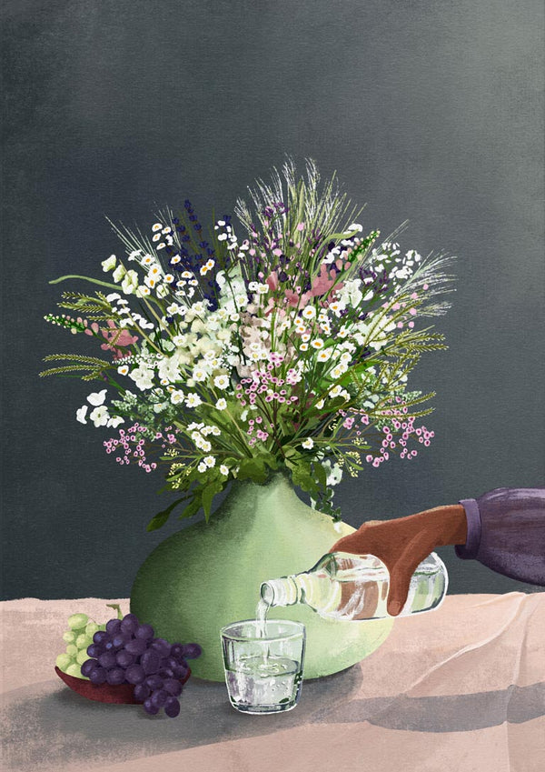 A vase of wildflowers beside grapes as water is poured into a glass, featured on Frivolous Afternoon - Goed Blauw.