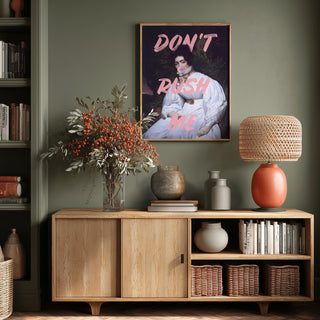 Framed "Sassy Lady Pink Bubble - Talitha McQueen" art print on a green wall above a wooden sideboard.