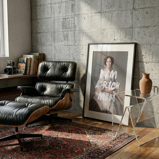Framed Elegant Rich Man Portrait by Talitha McQueen displayed in a modern, stylish living room setting.