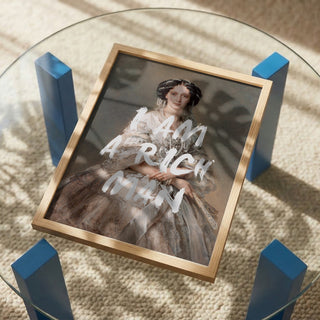Framed portrait of a well-dressed woman with "I AM A RICH MAN" written over the image.