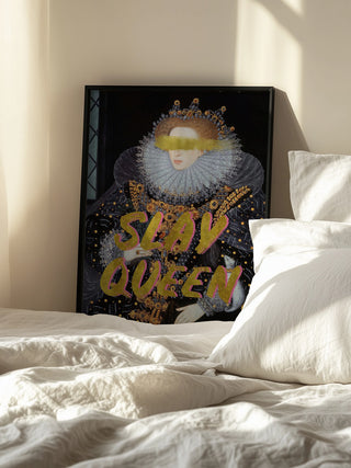 Framed Slay Queen Portrait - Talitha McQueen, propped against a wall beside a sunlit bed with white bedding.