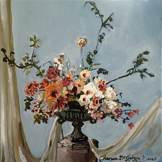 Wedding Arrangement by Mariam De Giorgio - cream roses and coral dahlias in a cast-iron urn on pale blue