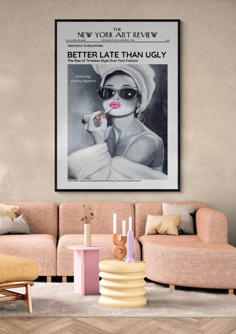 Audrey - Art Review Plakat above a pink sofa in a modern living room with pastel decor and candles.