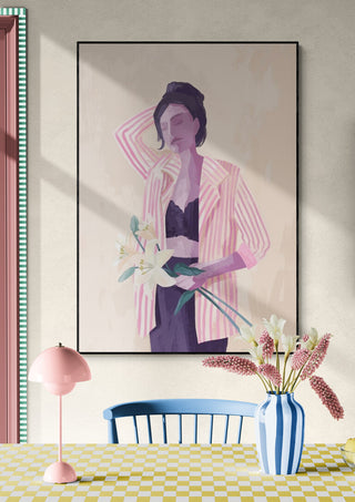 Art print of a woman in a striped jacket holding lilies, displayed above a pastel-colored dining setup.