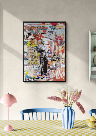 Art Answer 2 by Ricardo Noble poster displayed above a dining table with flowers and decorative items.