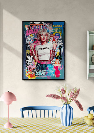 Framed Marilyn - Ricardo Noble pop art print hanging on a wall above a dining table with flowers and decor.