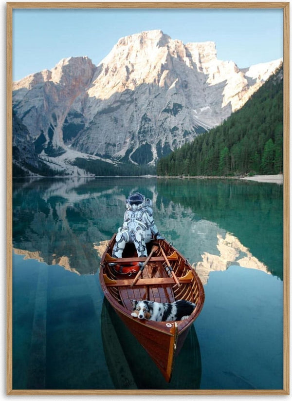Astronaut sitting in a canoe with two dogs on a calm lake, mountains and forest in the background.